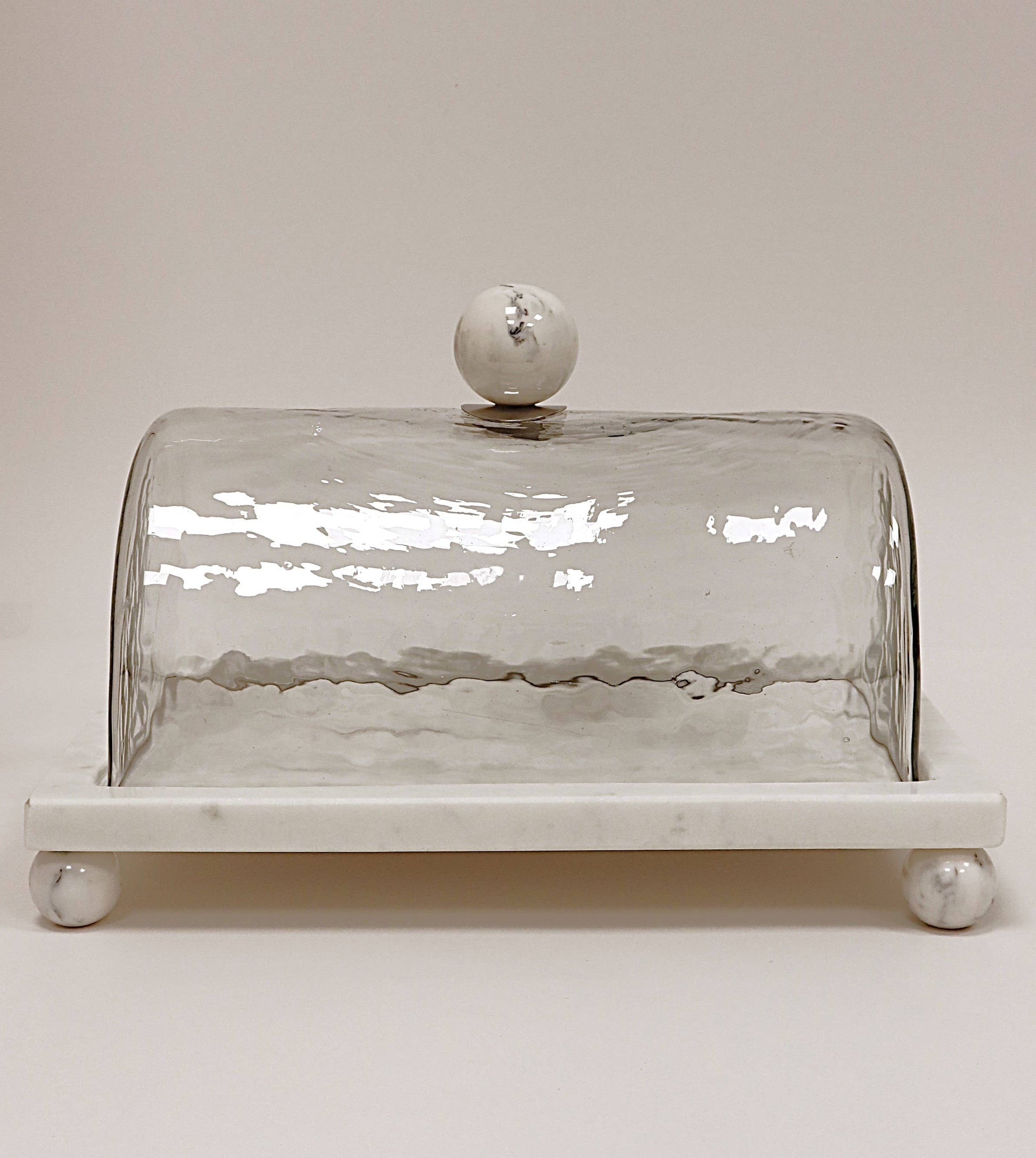 White marble cake platter with glass dome cover