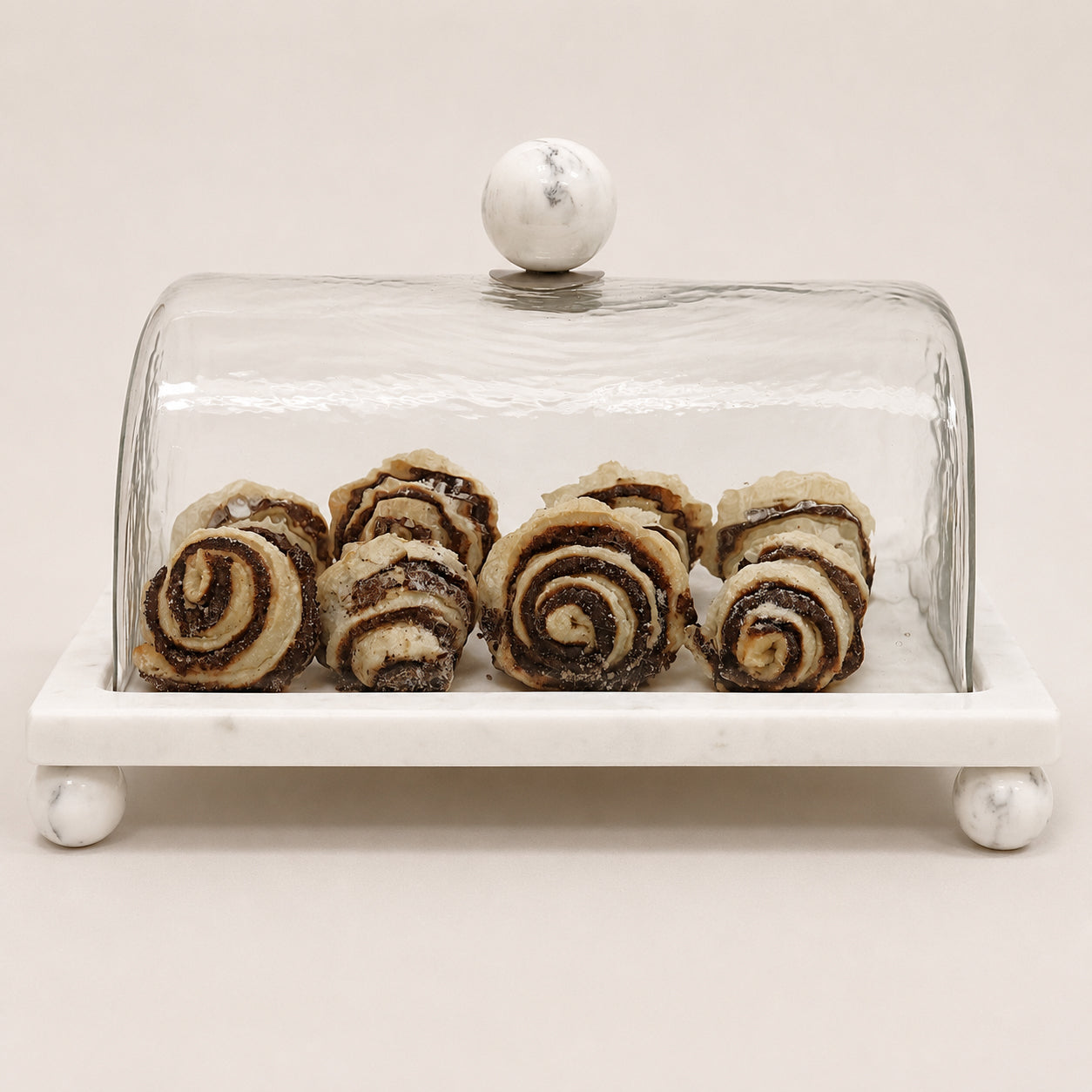 White marble cake platter with glass dome cover