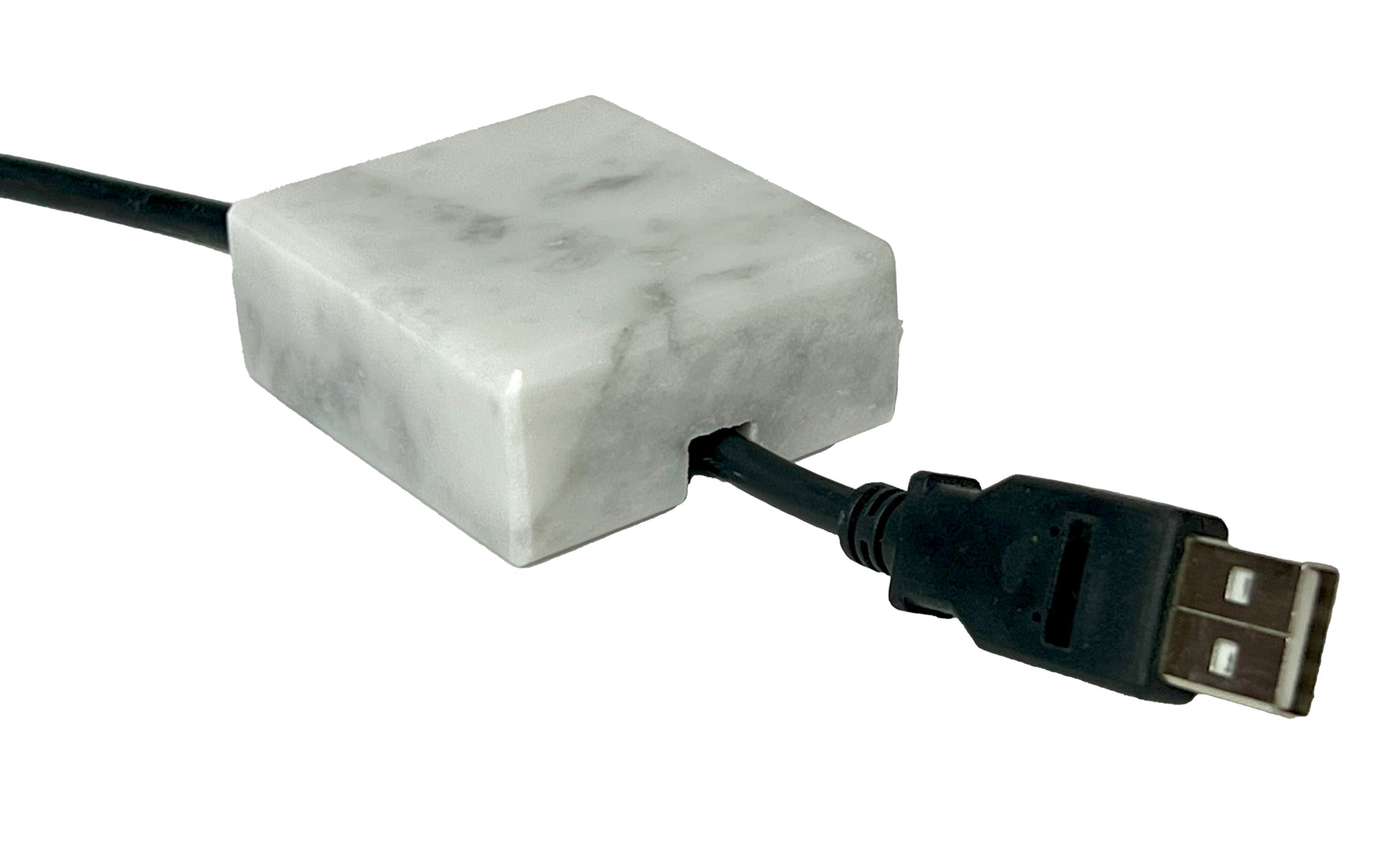White Carrara Marble cord organizer with polished finish, single-cable slot