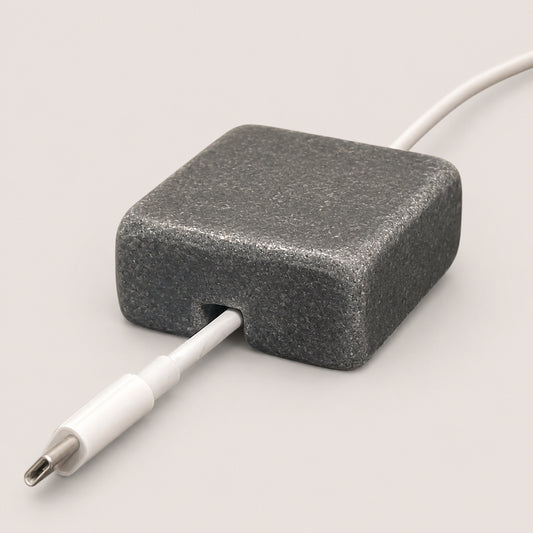 Black Granite cord organizer with tumbled finish, single-cable slot