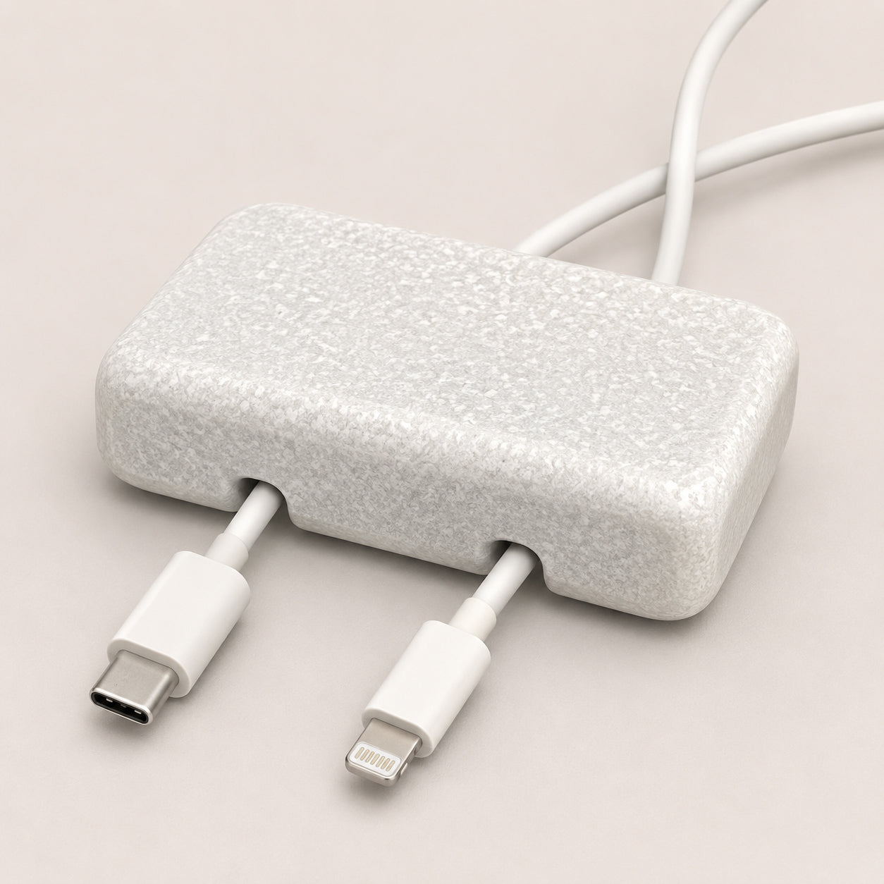 White Carrara Marble cord organizer with tumbled finish, double-cable slot
