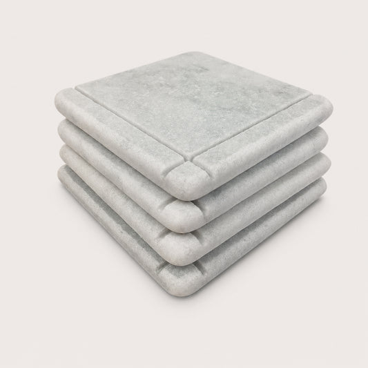 White Carrara Marble coaster with subtle hand-carved accent line, Design C