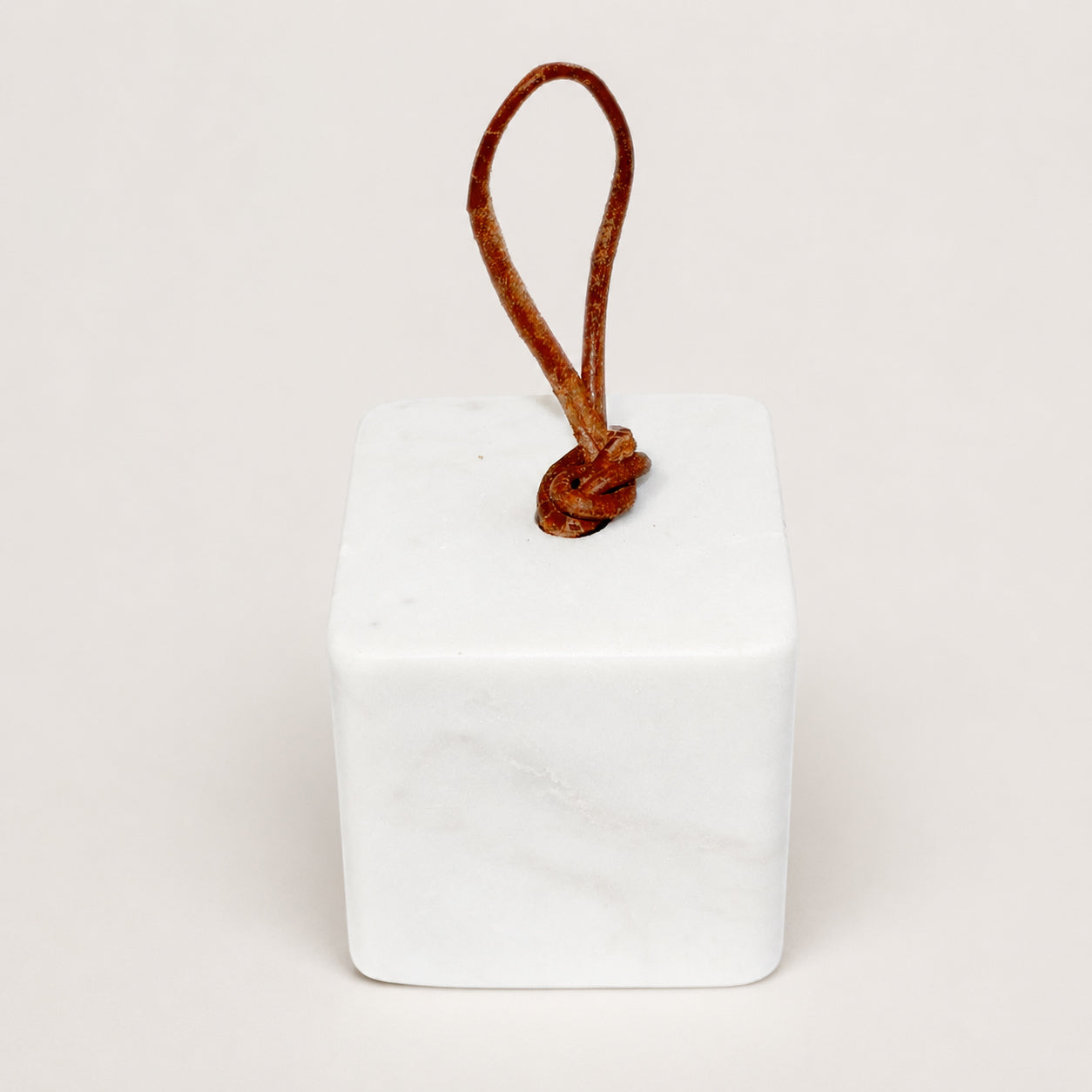 White marble door stopper with leather handle