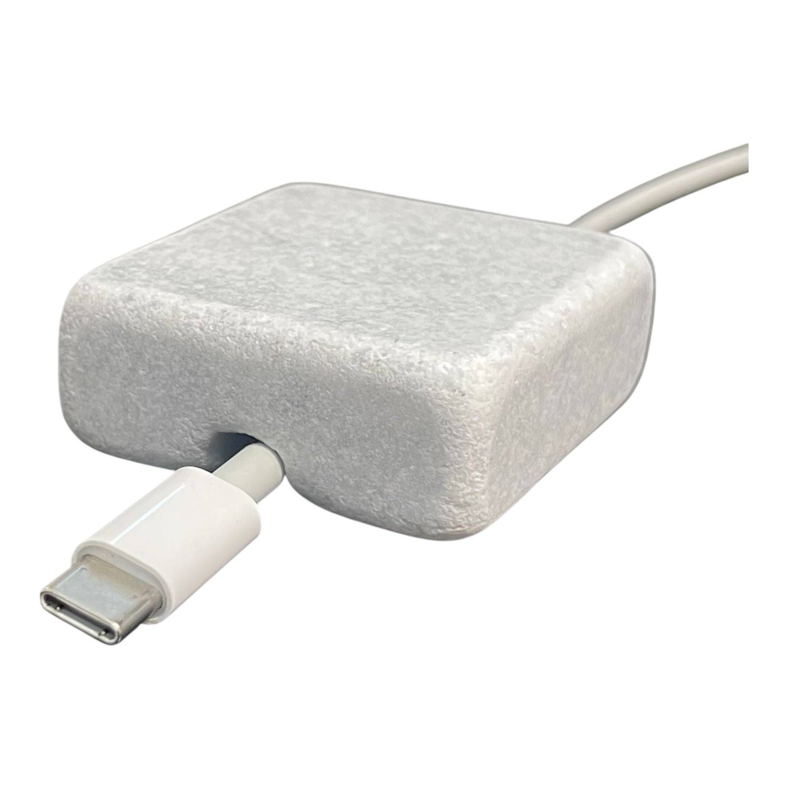 White Carrara Marble cord organizer with tumbled finish, single-cable slot