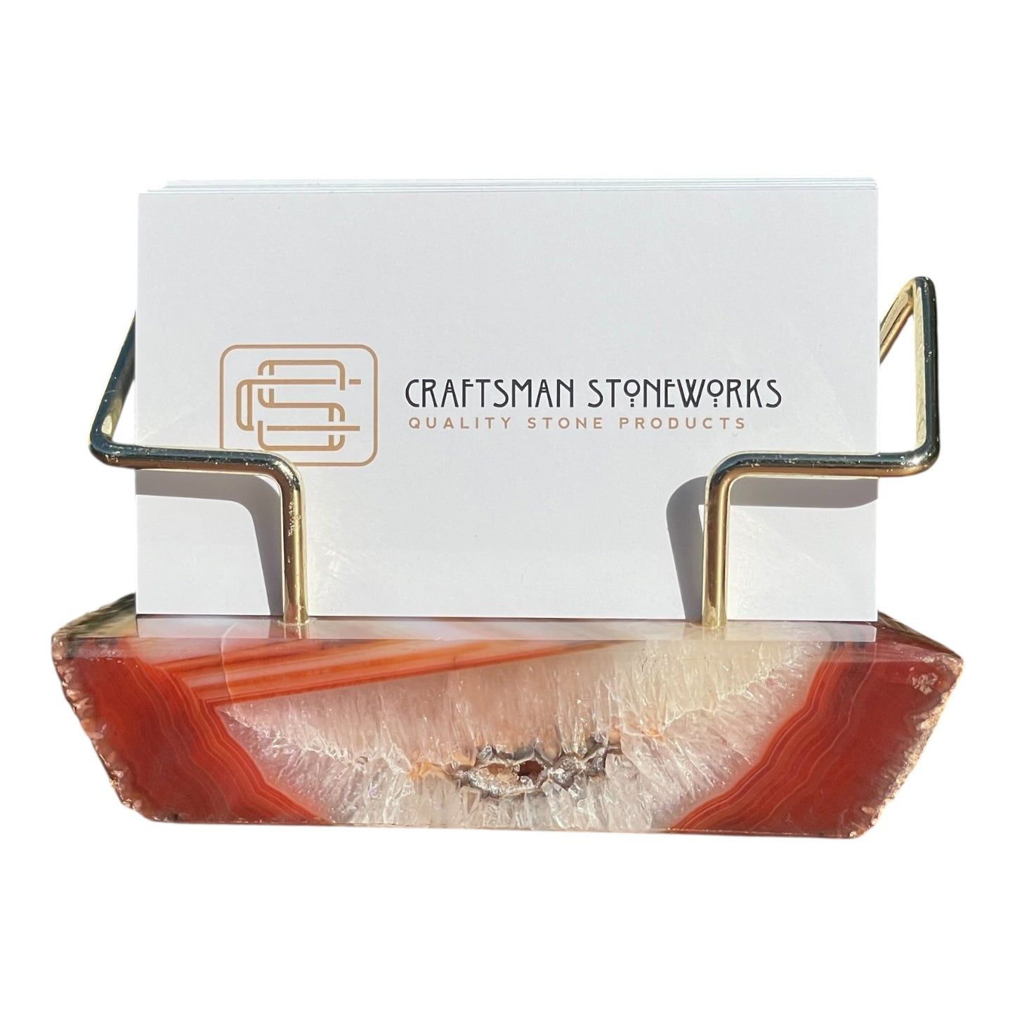 Red agate business card holder with gold wire frame
