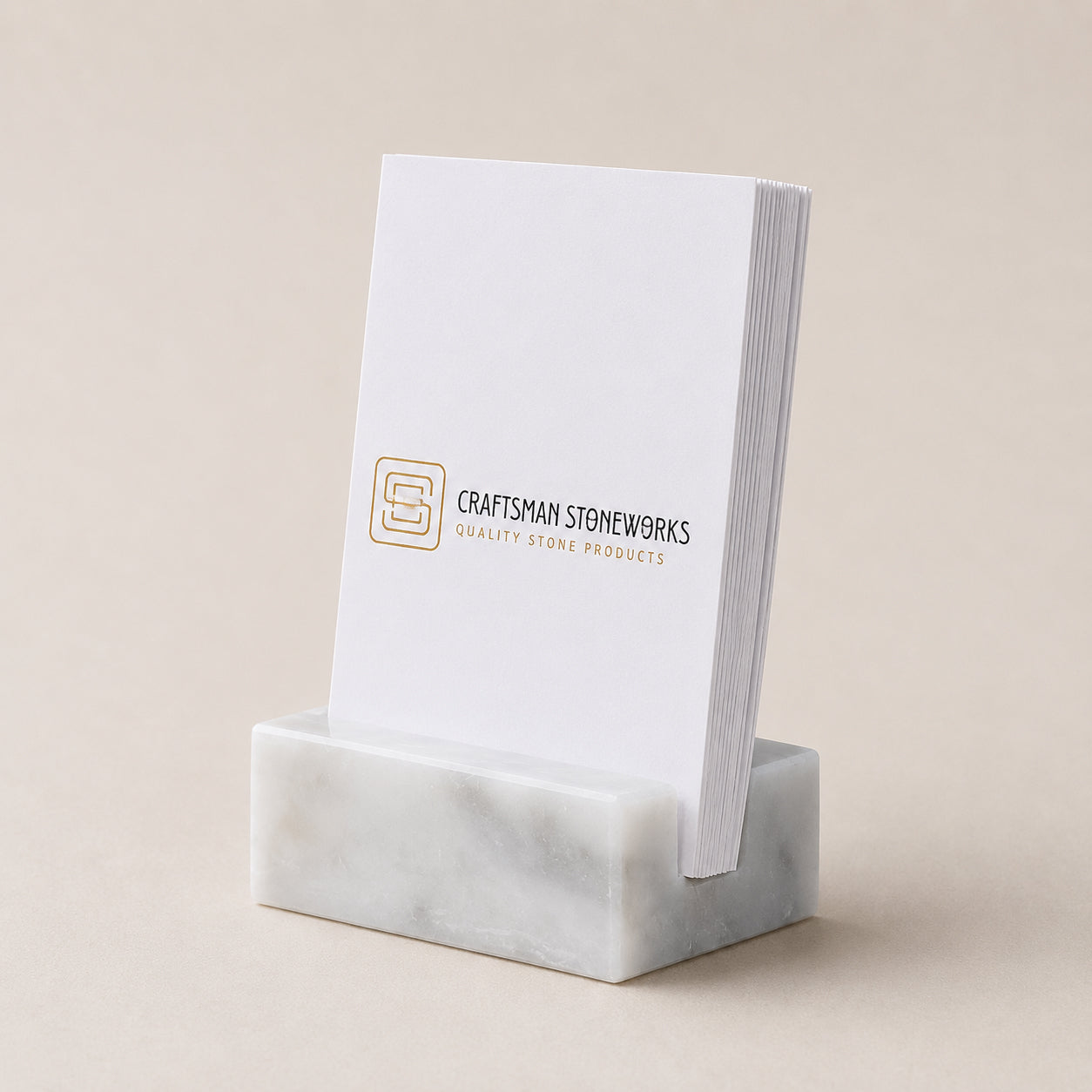 White Carrara Marble vertical business card holder on desk
