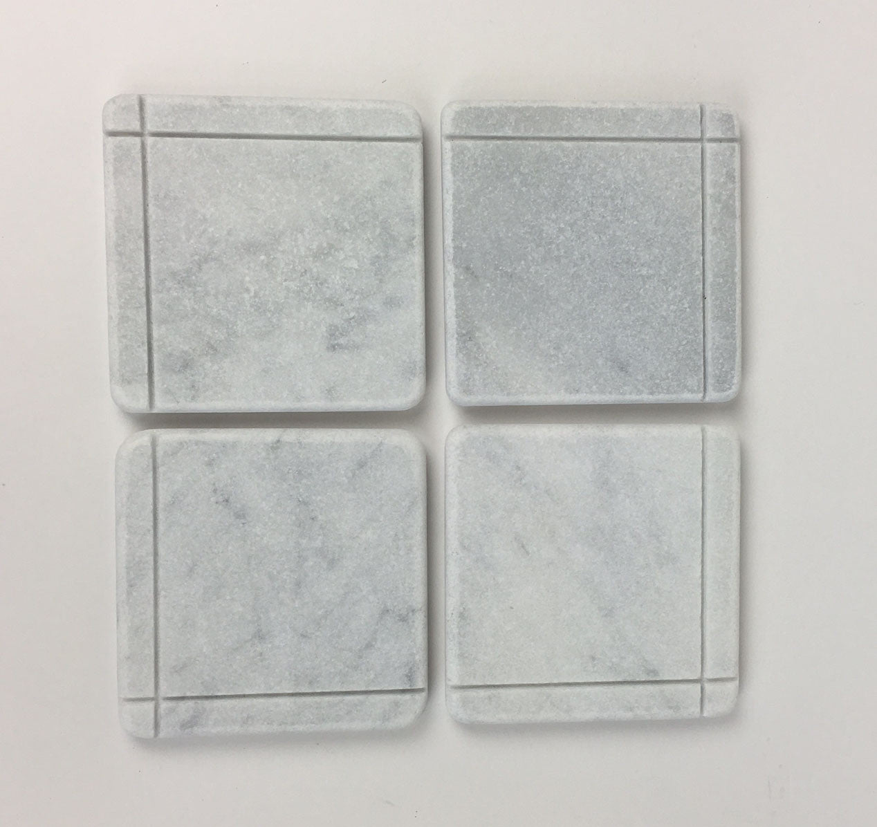 White Carrara Marble coaster with subtle hand-carved accent line, Design C