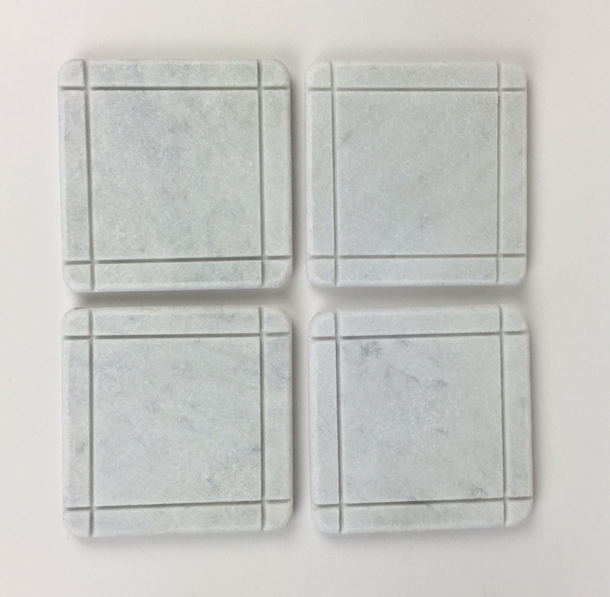 White Carrara Marble coaster with hand-carved linear accents, Design D